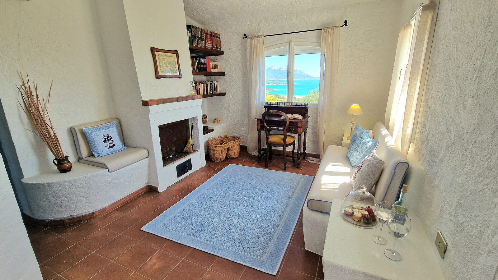 Living nook with fireplace and sea view