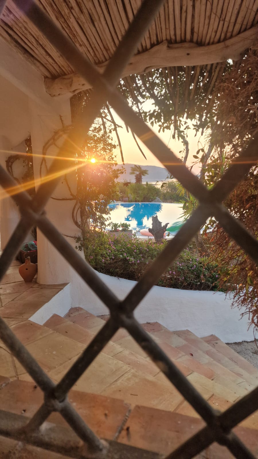 Sun glare, pool, and terrace
